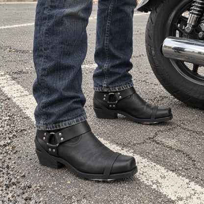 Rider wearing Sparkrider boots next to a motorcycle